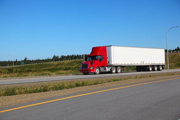 istock Semi-truck delivering its load 530558253