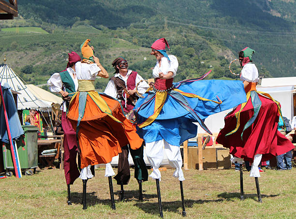 Sluderno, Italy - August 22, 2014: A Circateatro artist on stilts is performing during the Middle Ages festival in Sluderno.