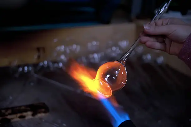 Closeup of flame and melting glass piece