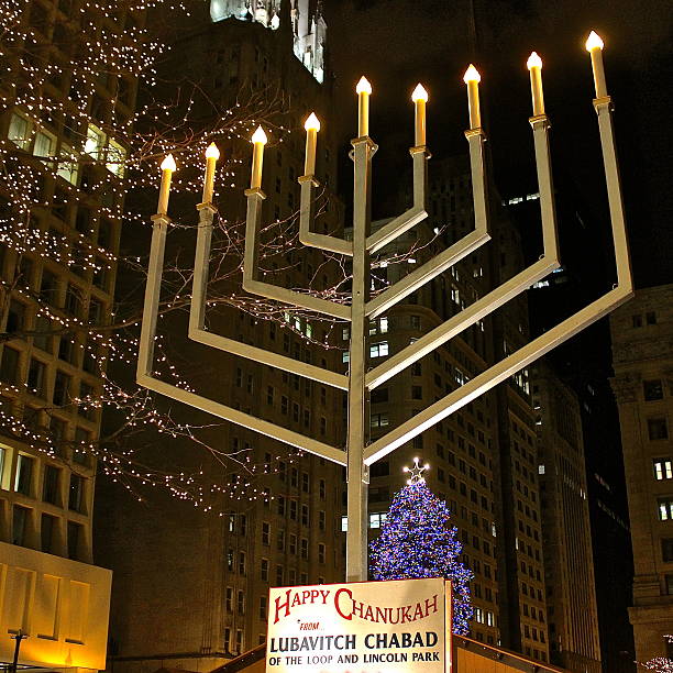 Hanukkah menorah across from Christmas tree in downtown plaza Chicago, IL, USA - December 26, 2014: Hanukkah outdoor electric menorah across from Christmas tree in downtown Daley Plaza. hanukkah shopping stock pictures, royalty-free photos & images