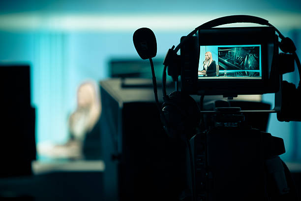 istock .Recording at TV studio with television anchorwoman 530560329