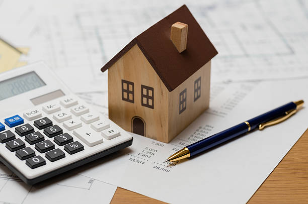istock Estimating construction costs of a house (XXXLarge) 530561167
