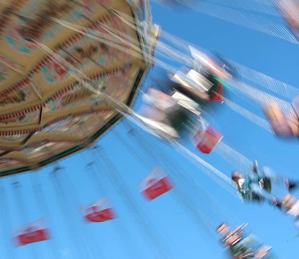 istock carousel in motion in closeup 530562347