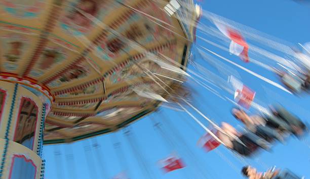 istock carousel in motion in closeup 530562361