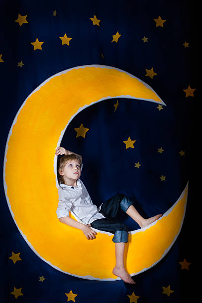 istock Boy sitting on the moon 530562793