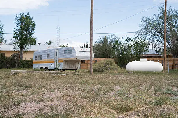 Photo of Breaking Bad Vacation Rental Company Concept New Mexico Deserted Caravan Trailer