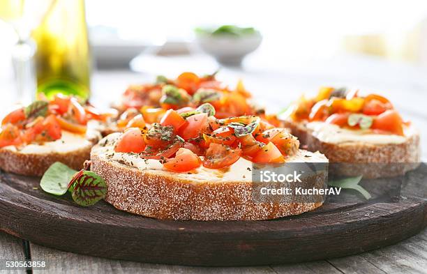 Sandwich With Tomatoes Goat Cheese And Basil Stock Photo - Download Image Now - Bruschetta, Cheese, Tapas