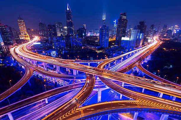 Elevated Highway in Shanghai, China. Aerial view of a highway overpass at night in Shanghai -  China. night freeway stock pictures, royalty-free photos & images