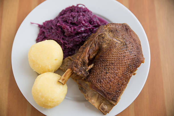 istock Roasted goose leg with braised red cabbage and dumplings 530567763