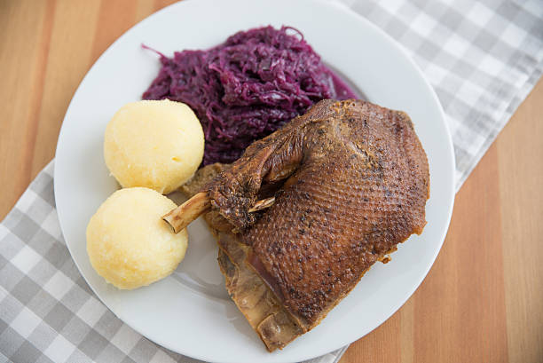 istock Roasted goose leg with braised red cabbage and dumplings 530567875