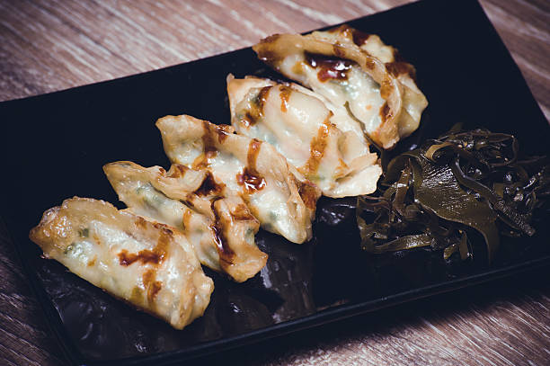 istock fried gyoza dumplings with sauce 530568031