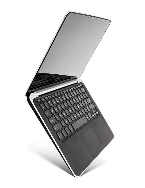 Hovering aluminium laptop, isolated on a white background. stock photo