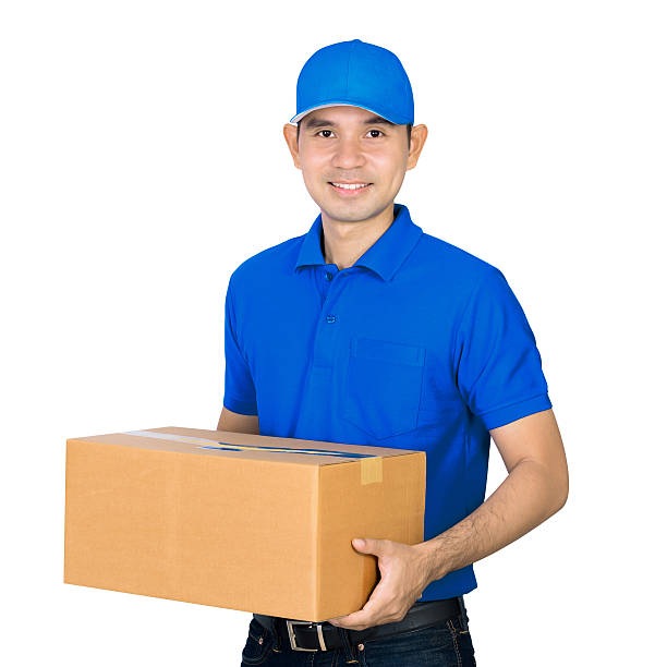 istock Asian deliveryman carrying a cardboard parcel box 530569042