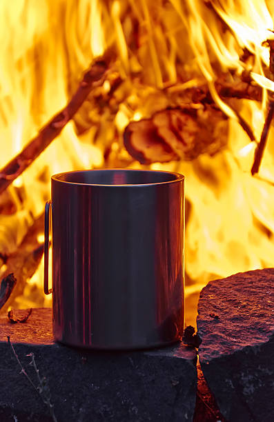 istock The metal cup are near campfire 530570385