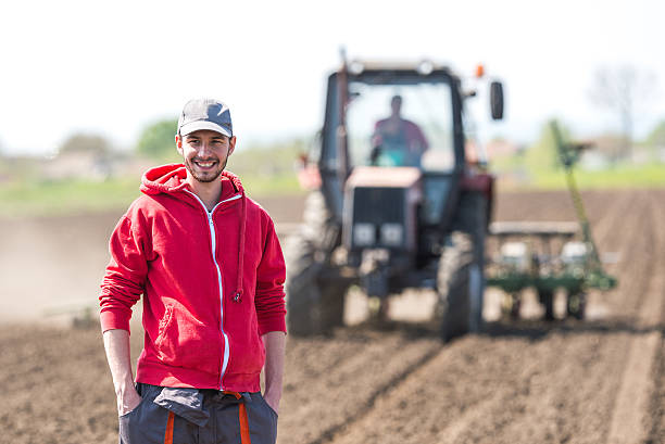 istock young farmer on farmland 530571180