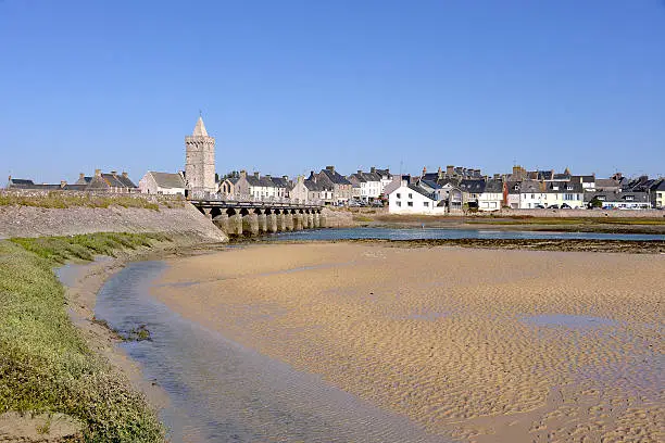 Beach and town with its church of Notre-Dame of Port-Bail or Porbail, a commune in the peninsula of Cotentin in the Manche department in Lower Normandy in north-western France