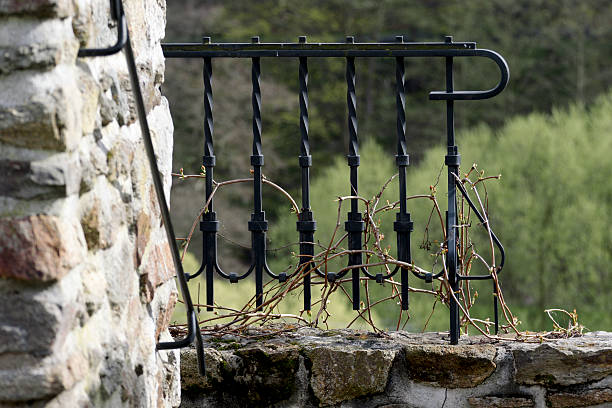 istock Historical street lamp on the stone wall 530574538