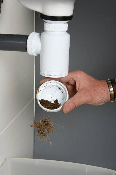 istock Plumber fixing the drain of a sink 530575980