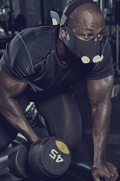 istock black athlete working out at a gym wearing mask 530579942