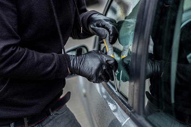 istock Car thief trying to break into a car 530579986