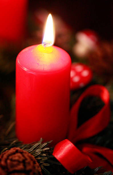 istock Single lit red Christmas candle 530579987