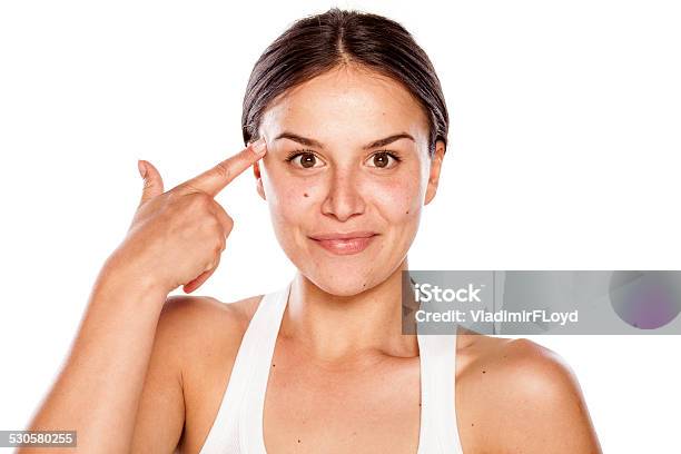 Girl Without Makeup With Finger On Her Forehead Stock Photo - Download Image Now - Adult, Adults Only, Beautiful People