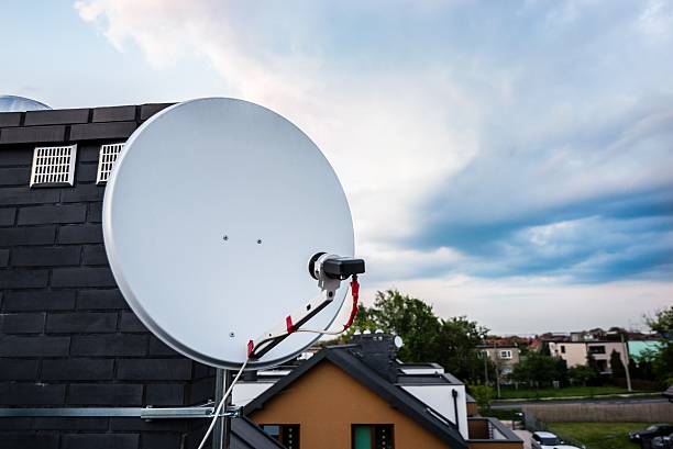 istock Satellite dish, satellite antenna mounted on the chimney 530580718