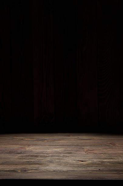 istock dark wooden background texture 530581329
