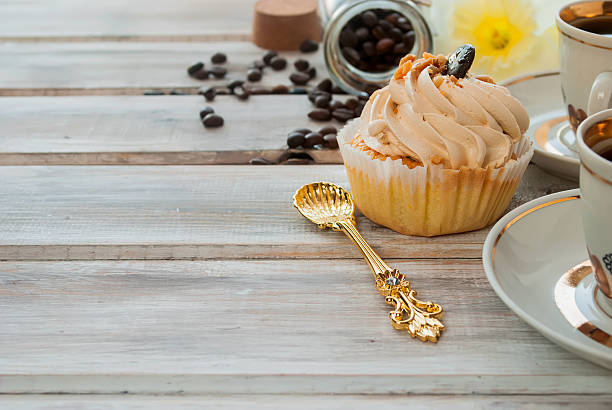 istock Cake and coffee cupand a bouquet of daffodils 530581868
