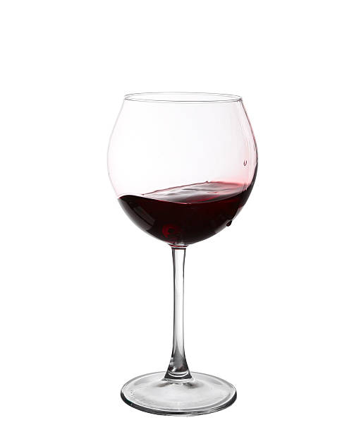 istock red wine swirling in a goblet wine glass 530582311