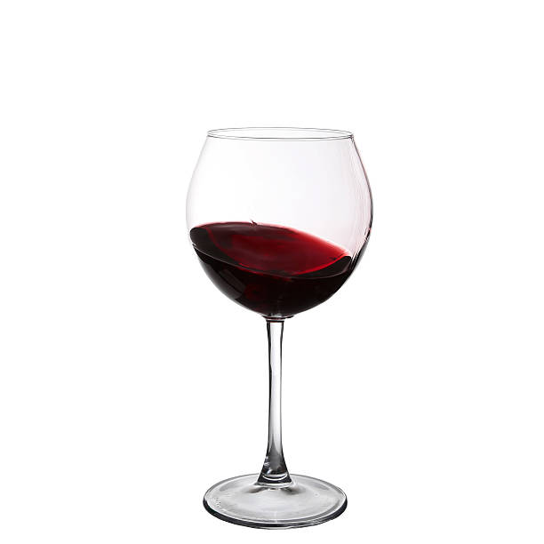 istock red wine swirling in a goblet wine glass 530582313