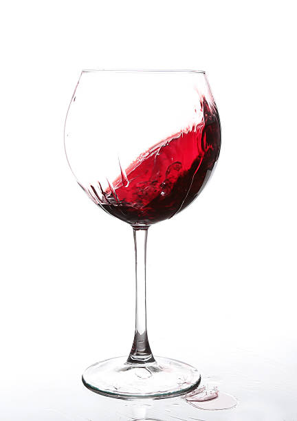 istock red wine swirling in a goblet wine glass 530582315