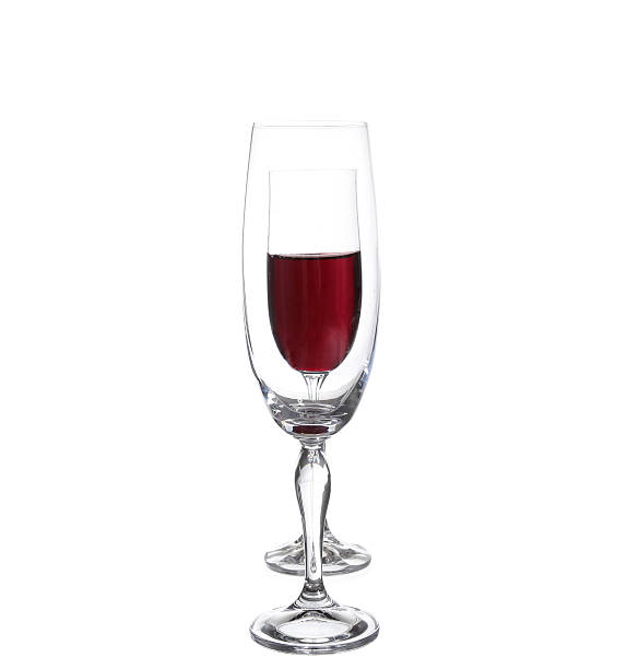 istock Full and empty champagne glasses with red wine 530583241