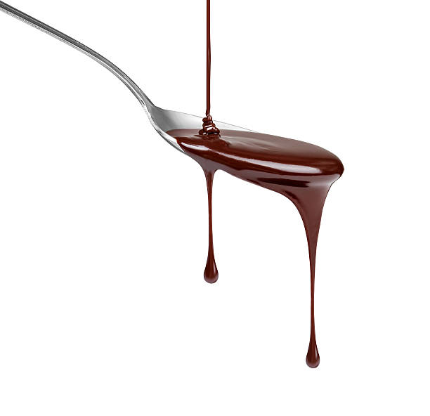 istock chocolate dripping from a spoon isolated on white background 530583923