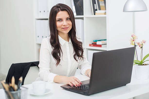 istock business woman with notebook in office, workplace 530583950