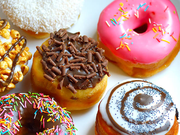 istock sweet delicious donut with toppings sugar 530584228