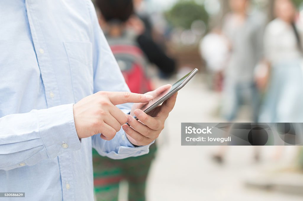 businessman use mobile phone in the modern city street Adult Stock Photo