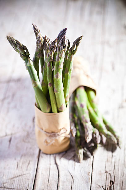 two bunches of fresh asparagus stock photo