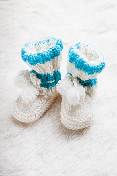 istock Knitted baby booties 530589282