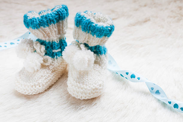 istock Knitted baby booties 530589356