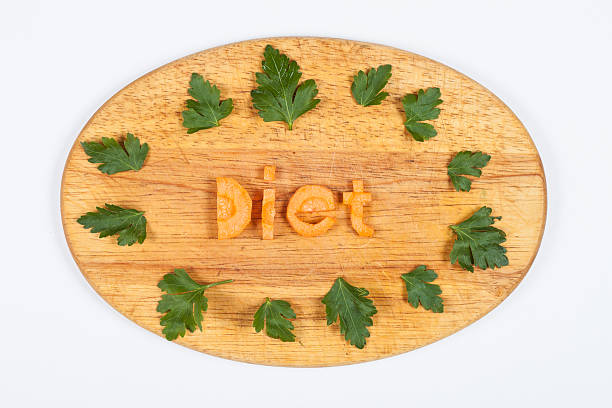 the word diet from carrots with leafs of parsley stock photo
