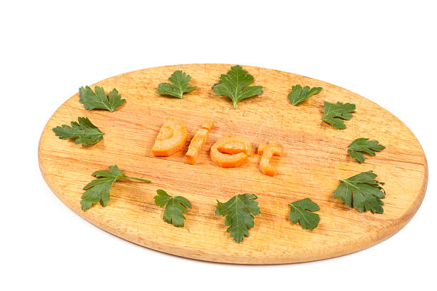 the word diet from carrots with leafs of parsley stock photo