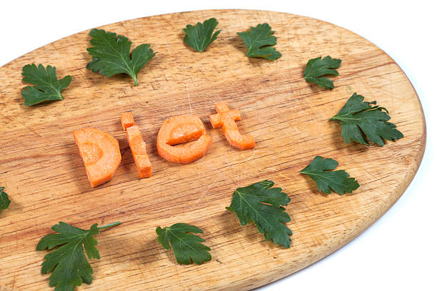 the word diet from carrots with leafs of parsley stock photo