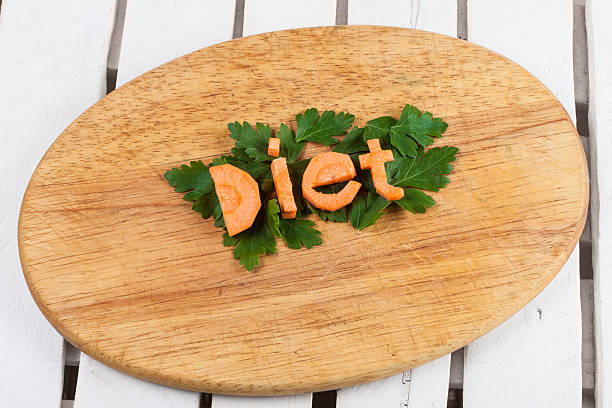 the word diet from carrots on a cutting board stock photo