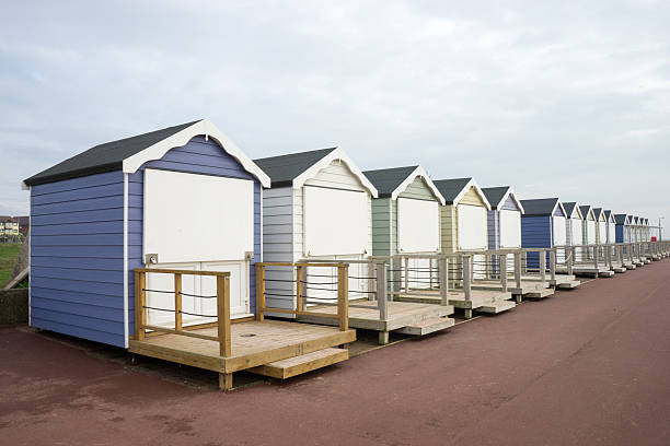 Beach Huts Closed up beach huts at Lytham St Annes.  The weather is overcast, with only hints of blue in the sky. lytham st. annes stock pictures, royalty-free photos & images