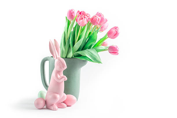 Pastel-coloured pink easterbunny with tulips stock photo