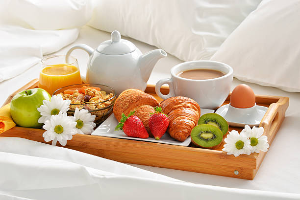 istock Breakfast tray in bed in hotel room 530590428