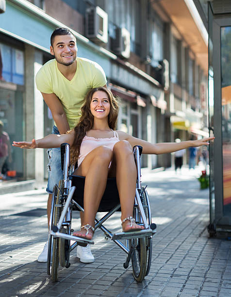 istock Husband taking spouse on wheelchair 530591647