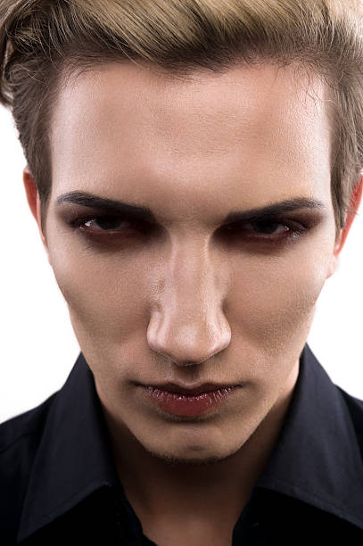 istock Serious male model with makeup 530592043