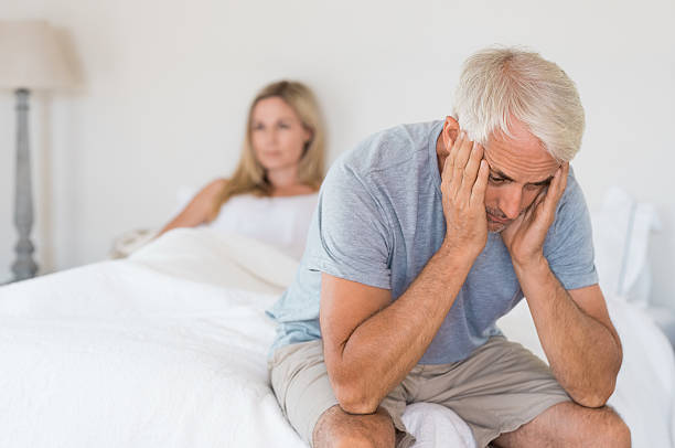Sexual problem concept Upset mature couple ignoring each other. Close up of a worried senior man in tension at bed. Senior couple angry with each other after a fight. weakness photos stock pictures, royalty-free photos & images